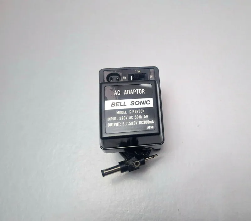 آداپتور نو چند کاره 6،7.5 و 9 ولت همراه کابل