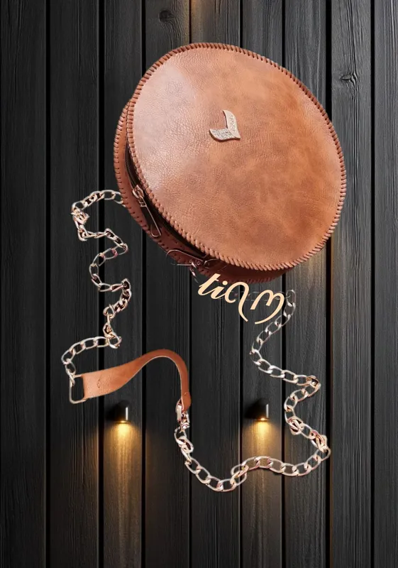 کیف چرمی گرد زنانه با بند زنجیری شیک و خاص