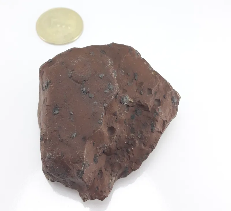 سنگ چگالی بالا .ذغال دار مشکوک به شهاب سنگ