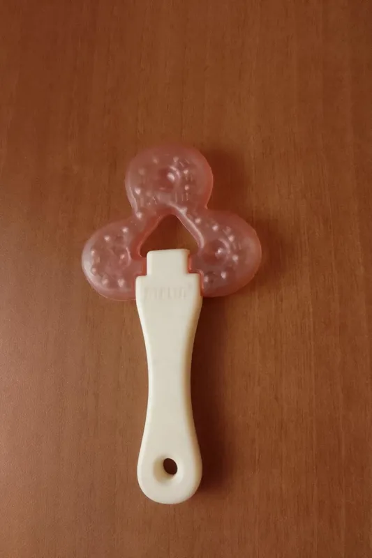 دندان گیر دندانی نوزاد کودک سفید صورتی آمریکایی