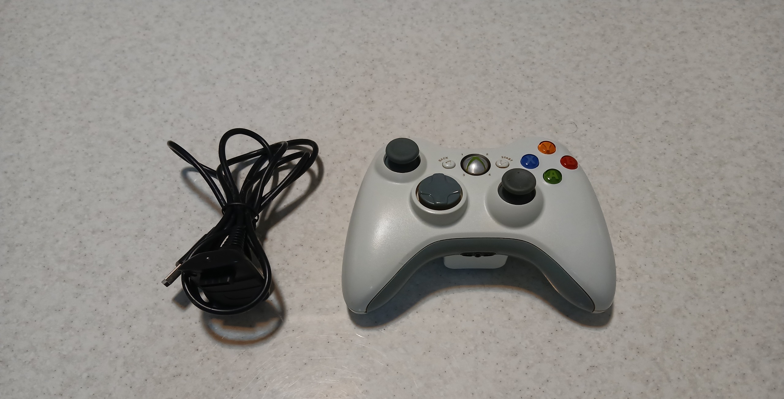 دسته بی سیمXbox 360 با کابل شارژ و درب باتری(مشکی)