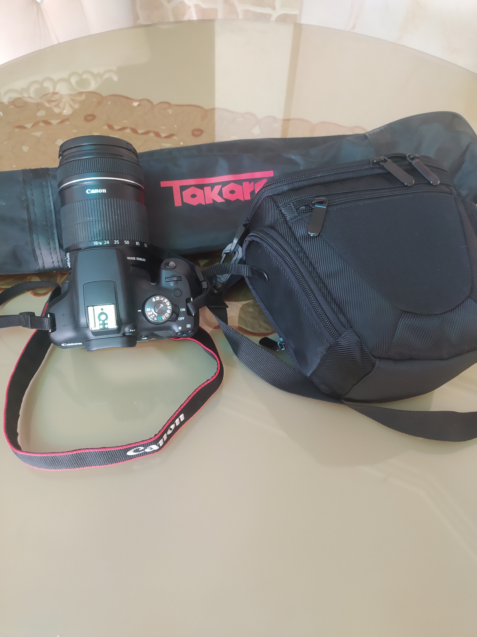 دوربین عکاسی کانن مدل 2000D با لنز 18_135