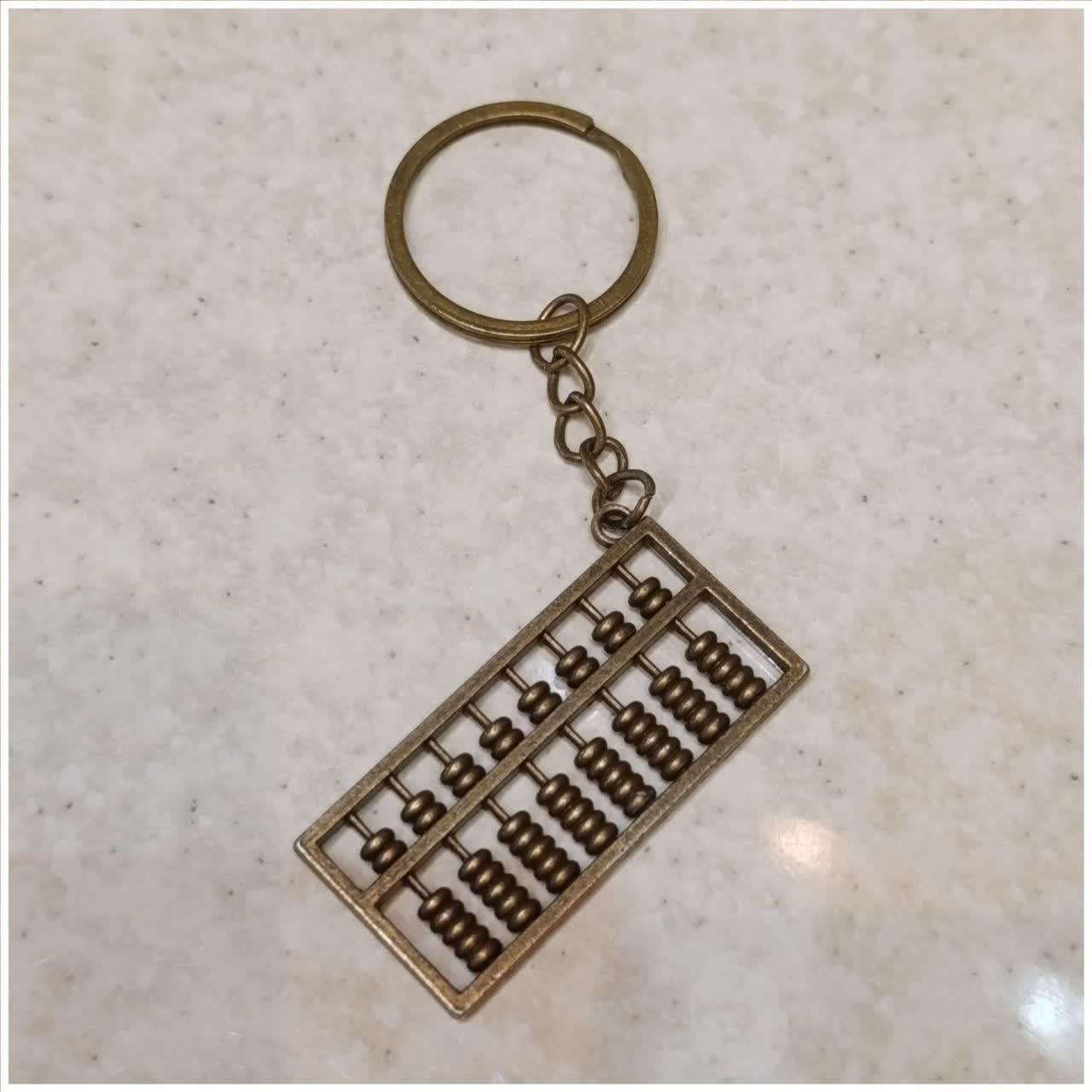 اویز چرتکه نقلی فلزی 4/5 سانتی توضیحات
