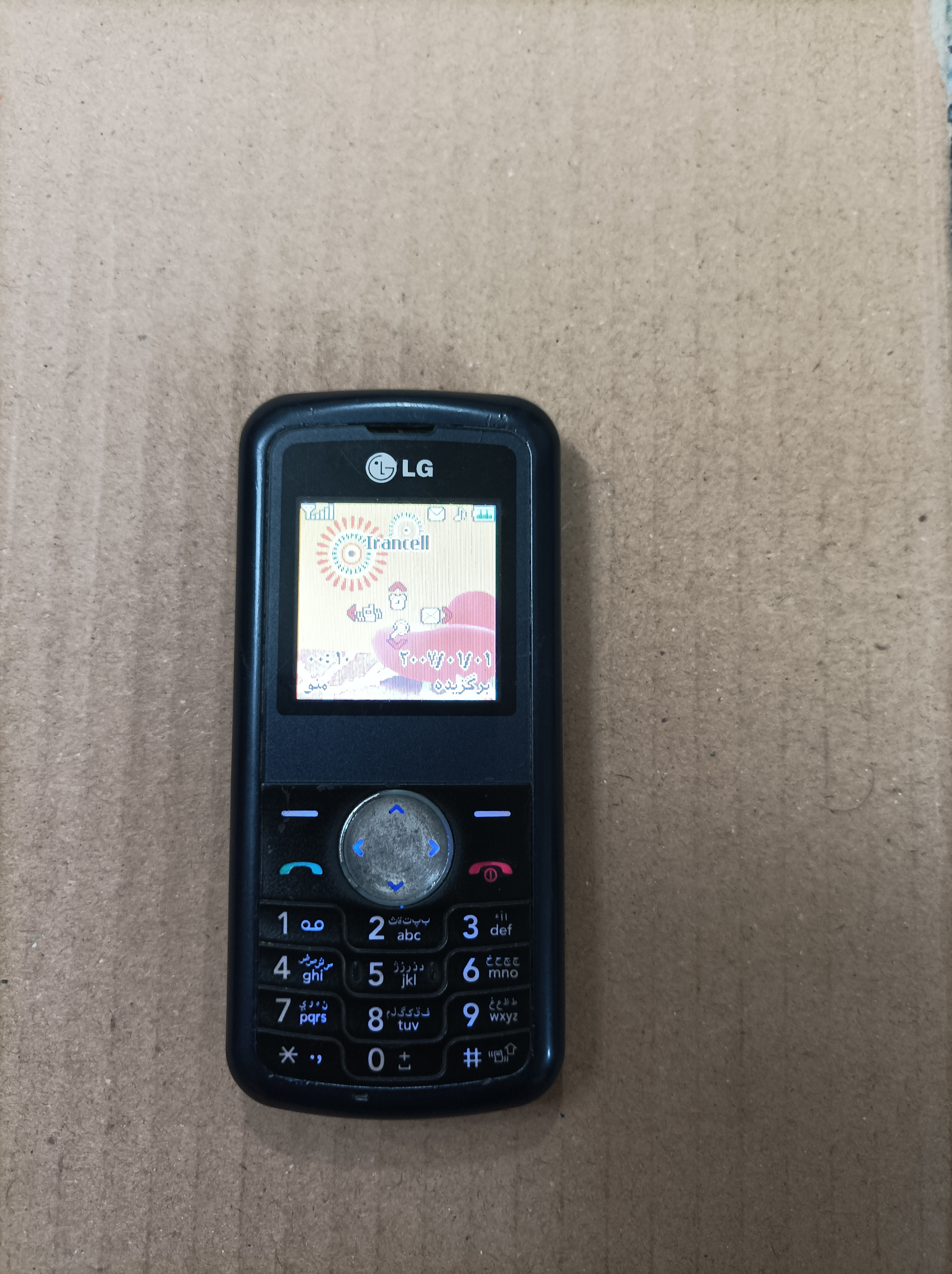 LG kp100 با باتری و شارژر