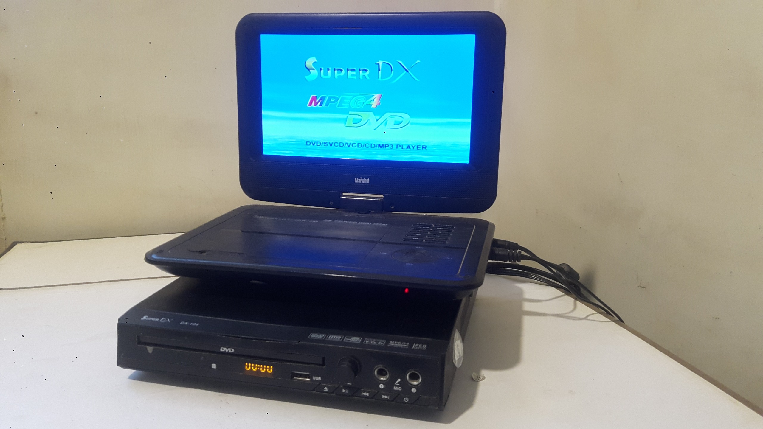 DVDپلیرفلش خورSuperDX مدل DX_104توضیح دارد