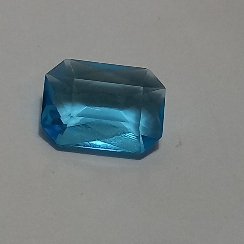 نگین توپاز آبی تراش جواهری زیبا سایز 14 در 10 میل