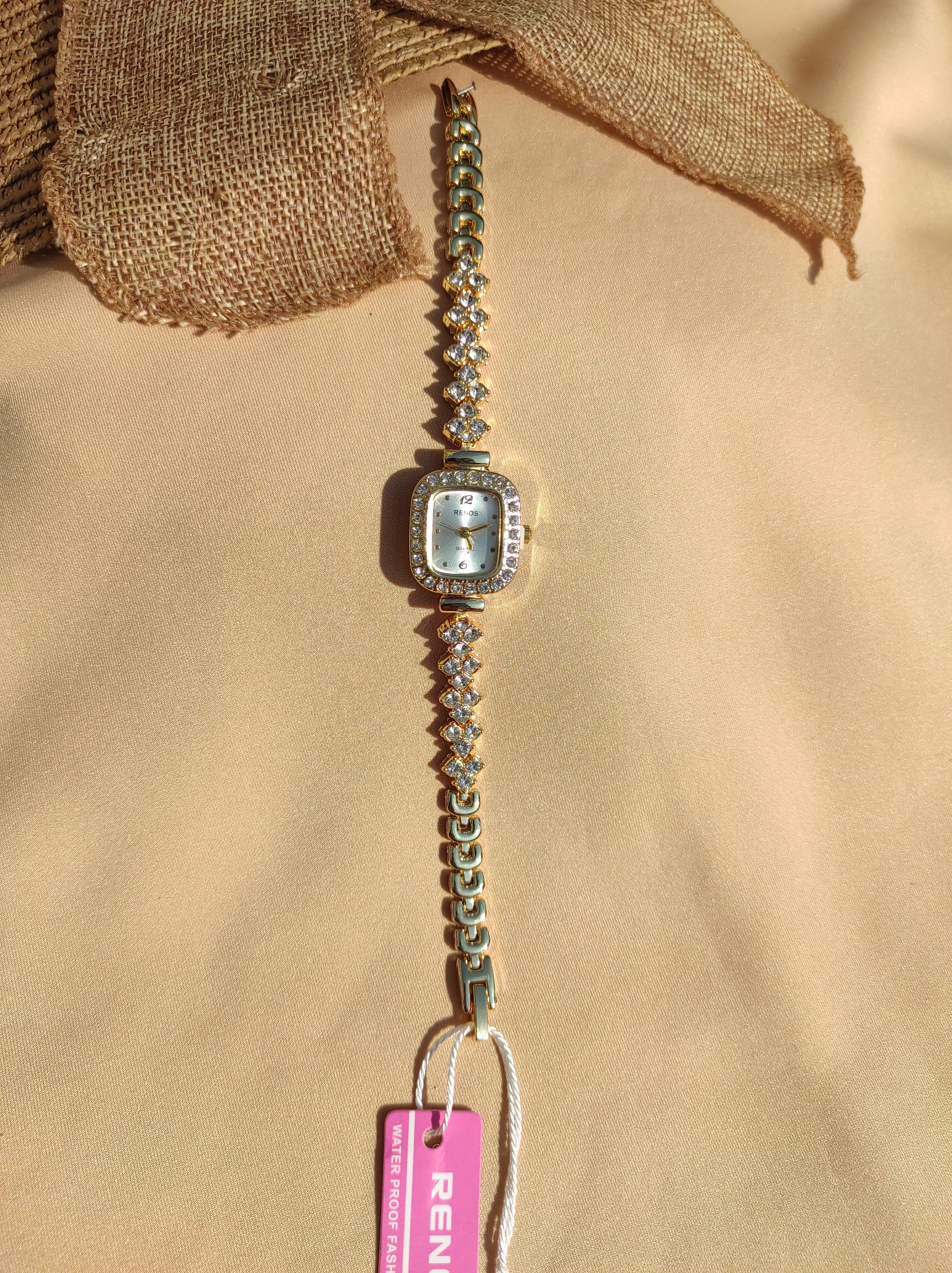 ساعت زنانه دخترانه مجلسی نگیندار طلایی صفحه سفید