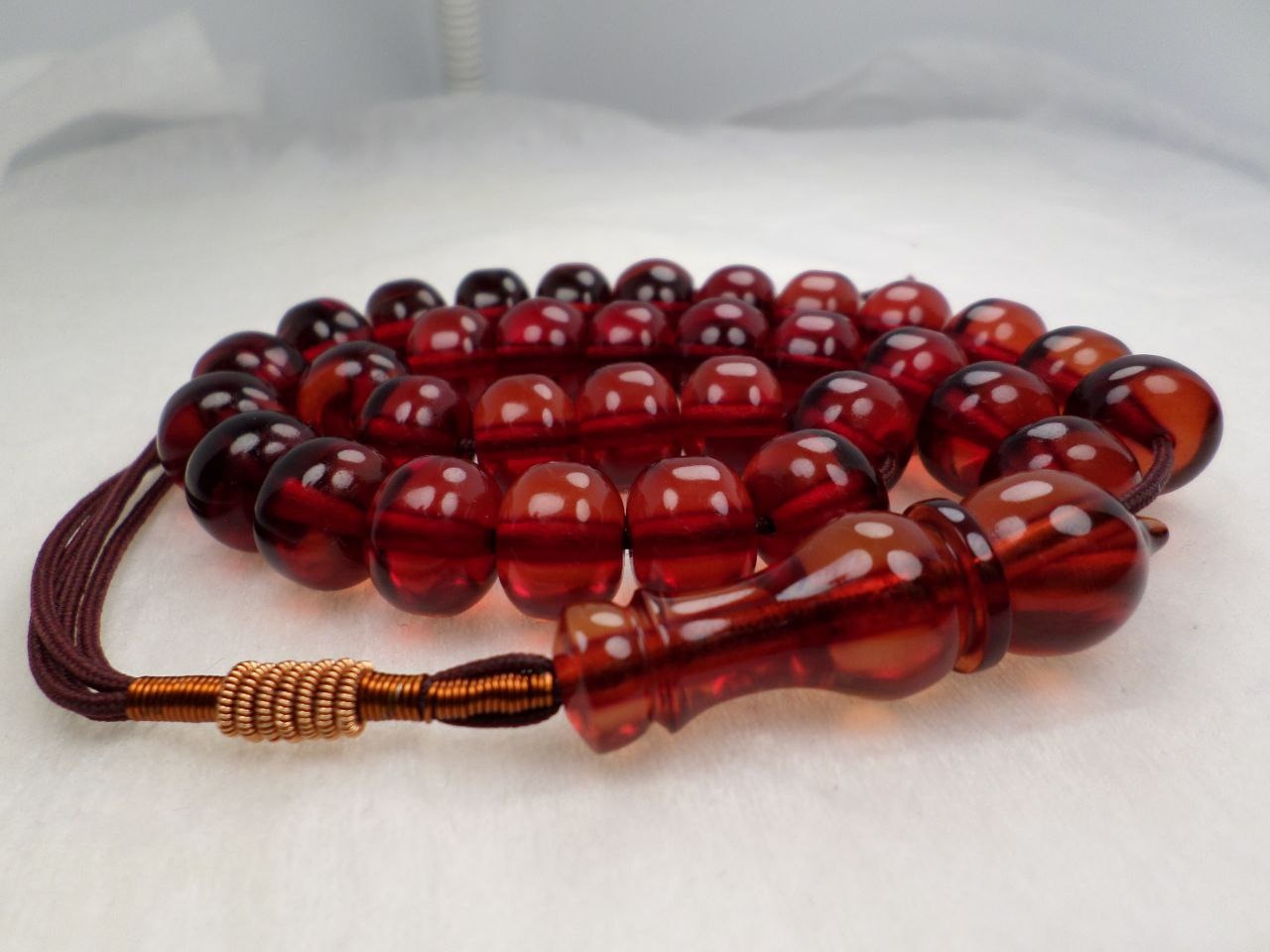 تسبیح سندلوس 33عددی زعفرانی پاتین دار کد 356