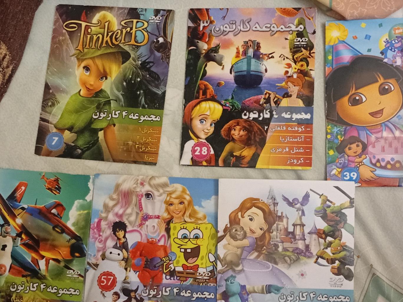 18 عدد DVD اورجینال و پلمپ . توضیحات دارد
