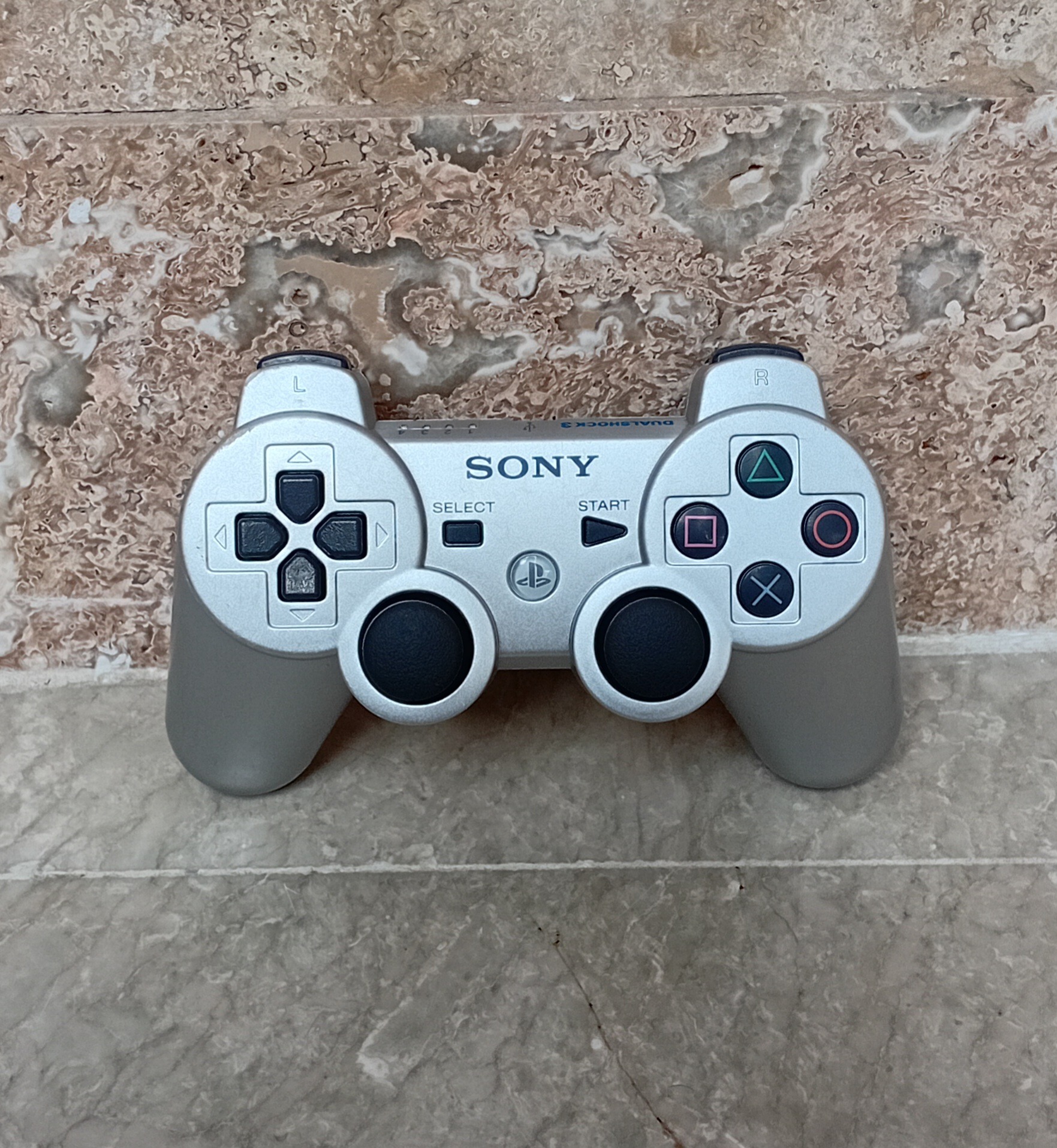 دسته اورجینال PS3 نقره ای باتری 500 میلی آمپر