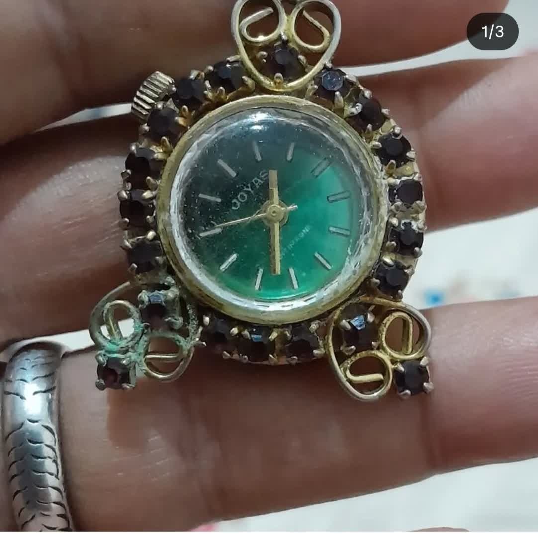 ساعت قدیمی یاقوت بنفش
