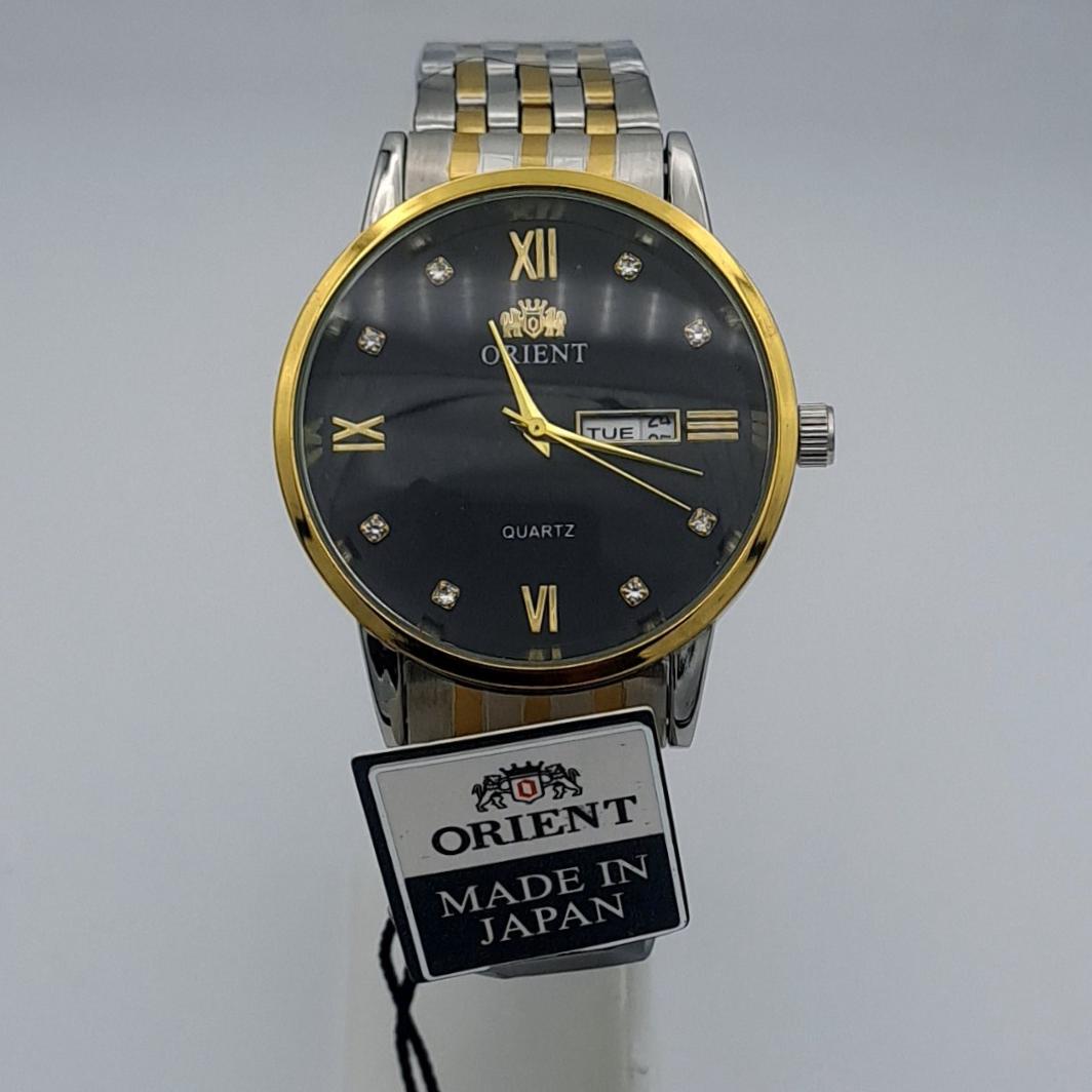 ساعت اورینت مردانه بند دو رنگ